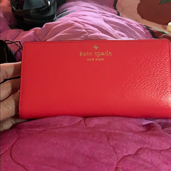 Kate Spade coral colored wallet. - Picture 2 of 3